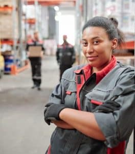 Young female worker in warehouse